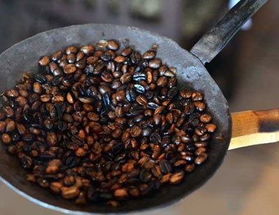 coffee being roasted in pan